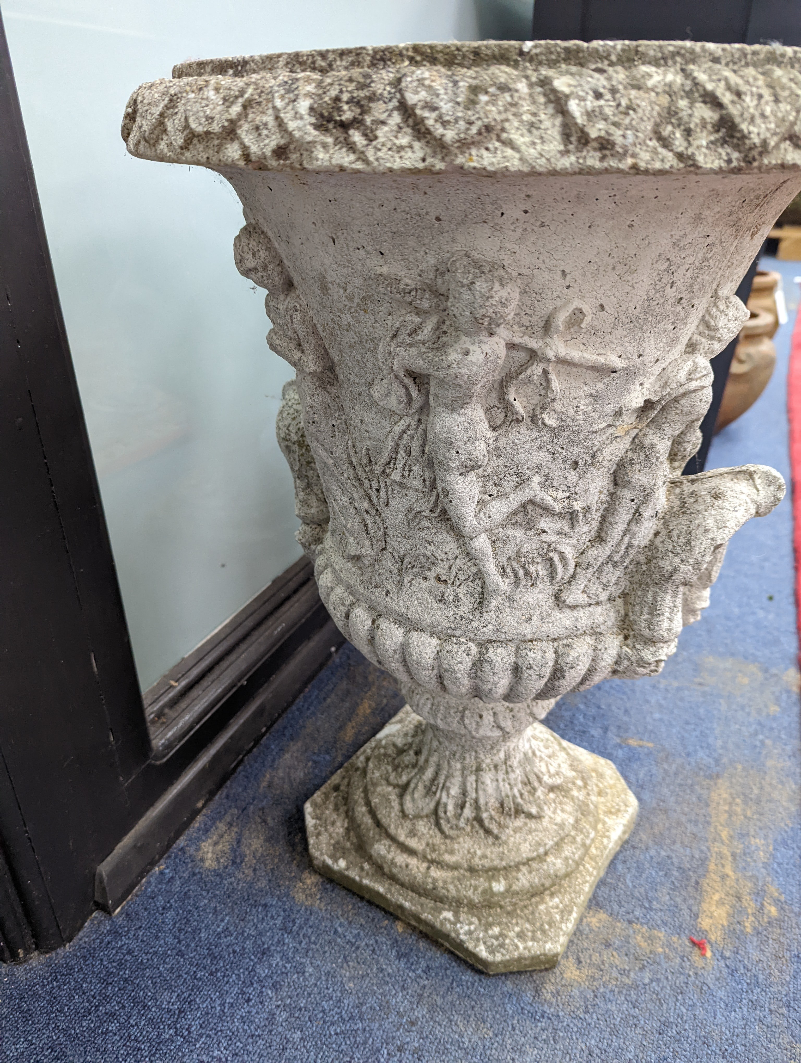 A pair of reconstituted stone campana garden urns, diameter 40cm, height 56cm